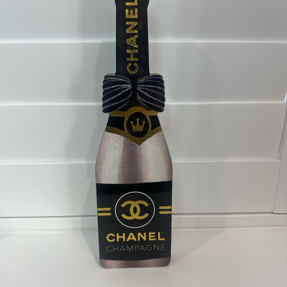 CHANEL Black and Gold Champagne Bottle Décor with Black Bow